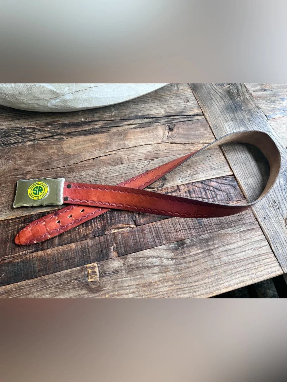 Men’s leather belt with “Southern Railway Serves the South” belt buckle.